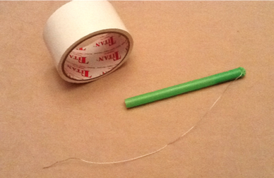 tape and a straw with wire