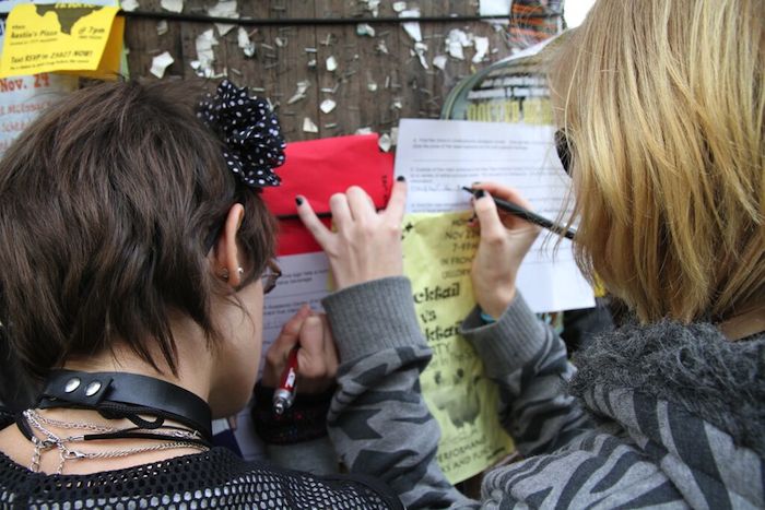 students writing something down