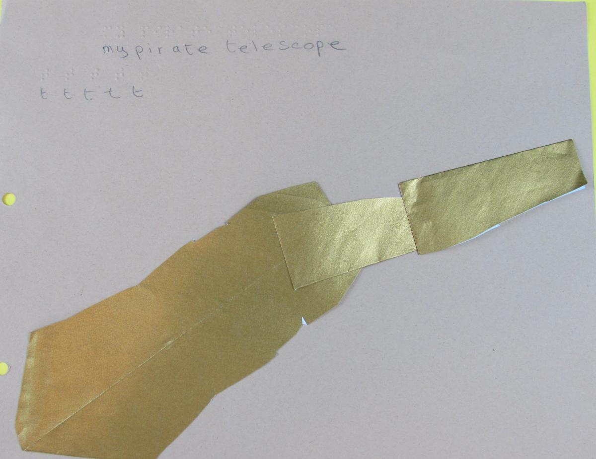 Picture of telescope made by child – child braille’s lines of t t t t 
