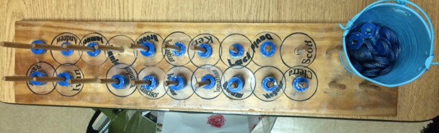 blue tokens stacked on peg board