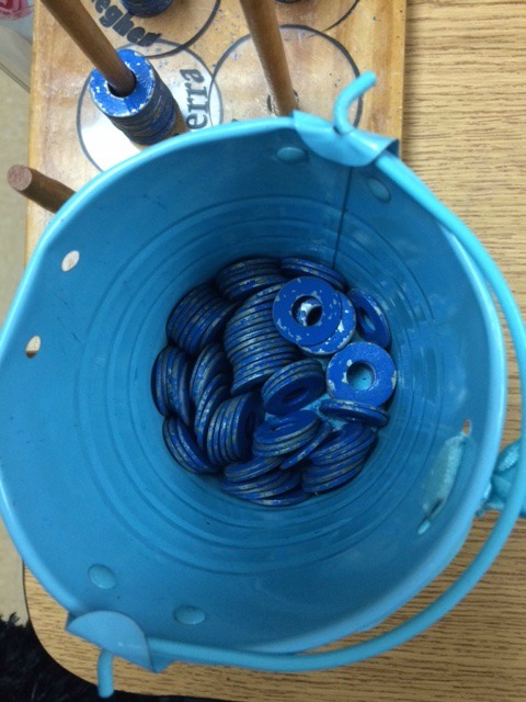 blue bucket filled with blue tokens