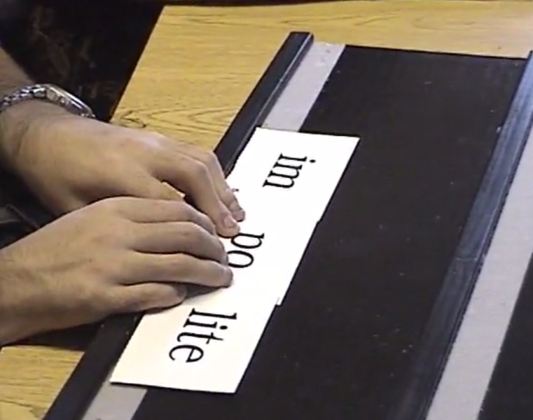 student using Wilson Reading System in braille