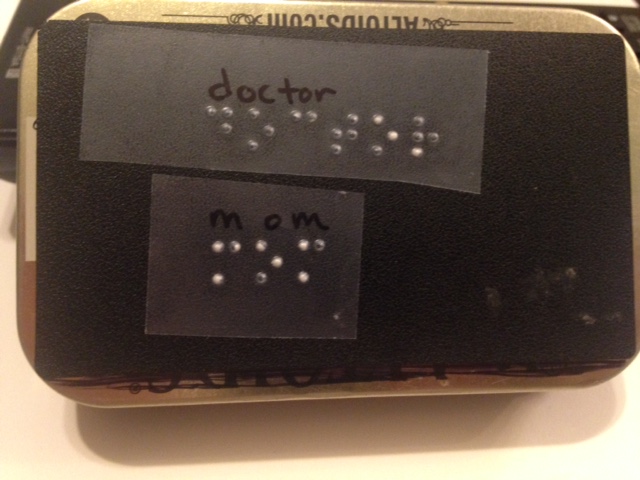 Altoid box with braille label