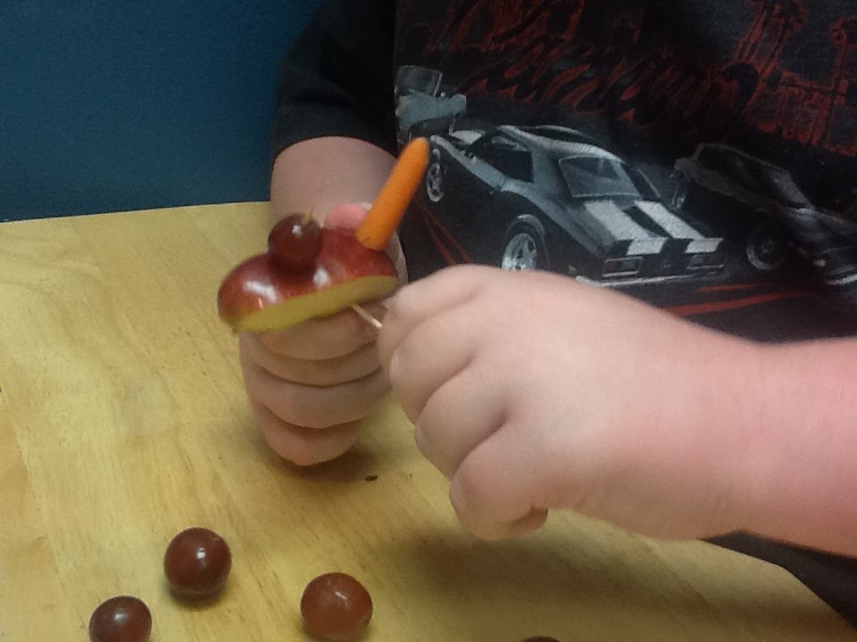 Making an apple car with grape wheels