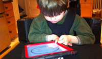 Boy using iPad