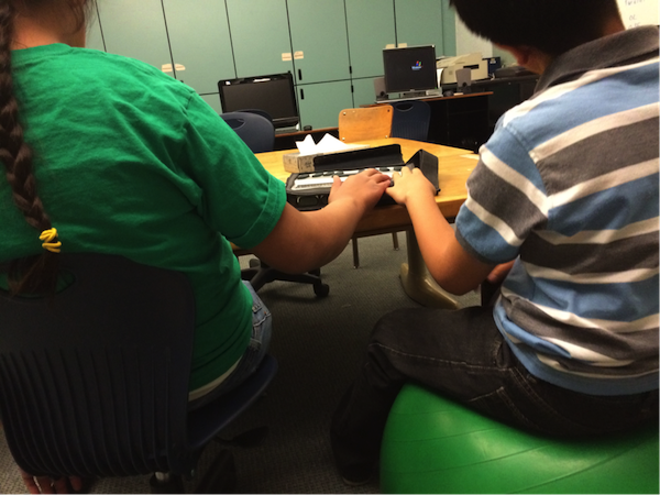 student using electronic braille notetaker