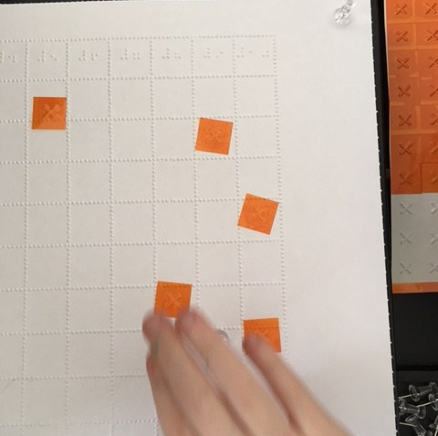 Using Feel and Peel Tactile Stickers to mark misses