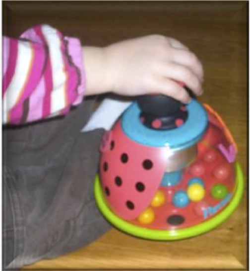 game that strengthens arm and hands by pushing on the top