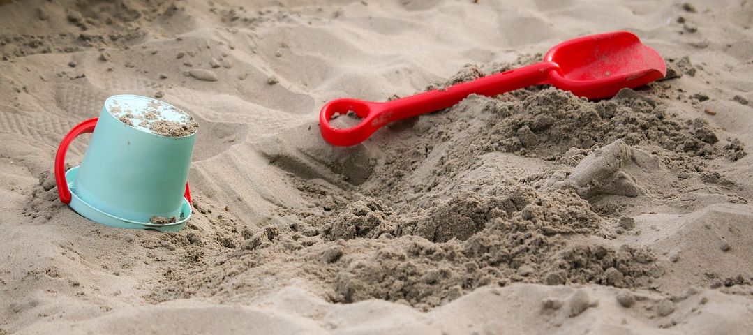 Sand with plastic bucket and shovel