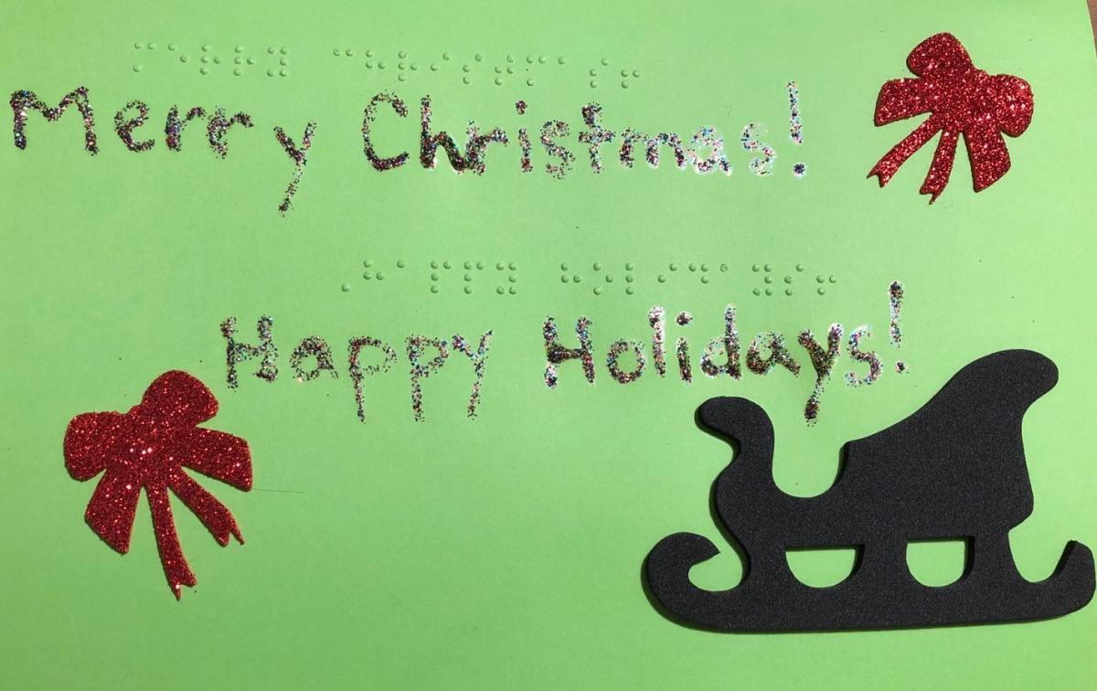 Holiday card with text in print and braille:  merry christmas!  Happy holidays!