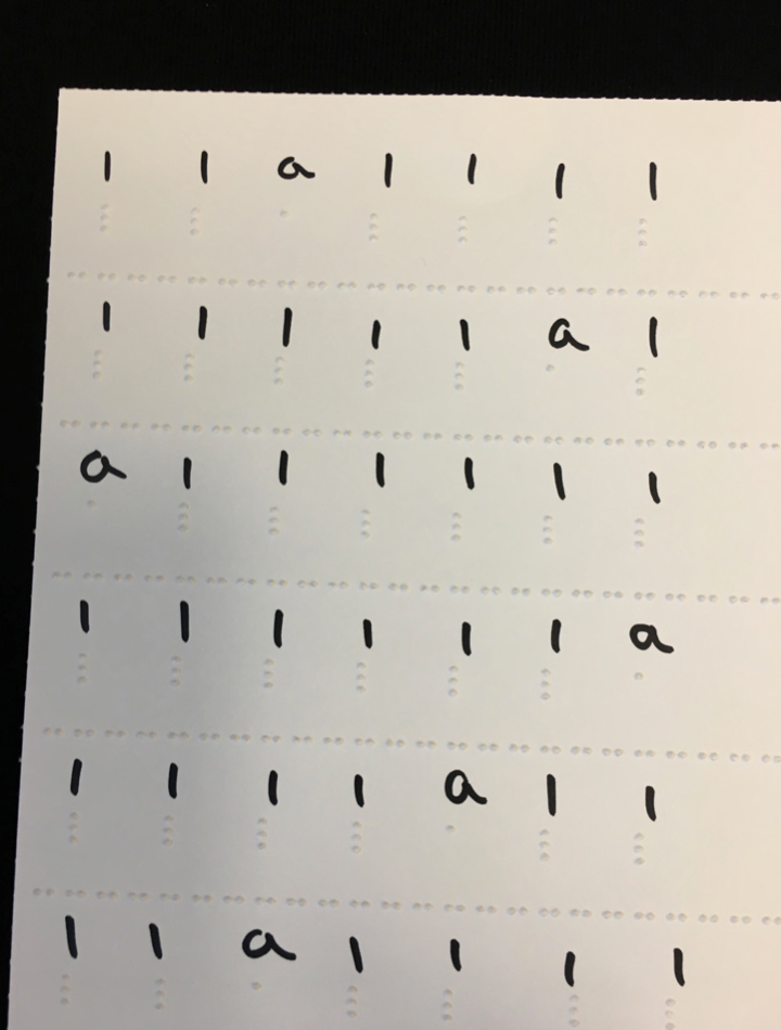 Braille tracking sheet with the letters a and l.