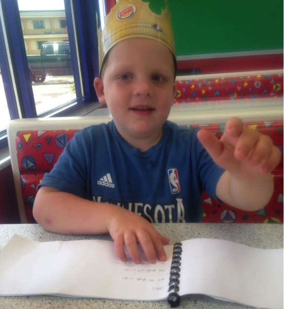 Reading a braille book at Burger King Reading a braille book at Burger King