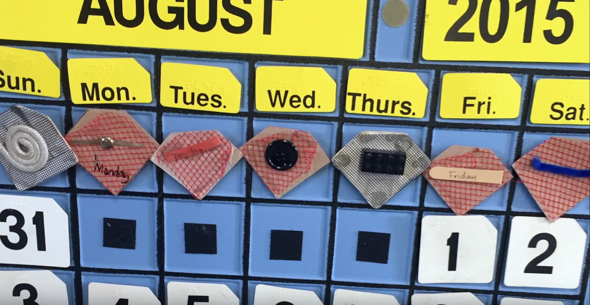 Monthly calendar with tactile symbols