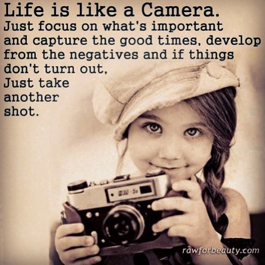 Photo of a young girl holding a camera with text: Life is like a camera.  Just focus on what's important and capture the good times, develop from the negatives and if things don't turn out, just take another shot.