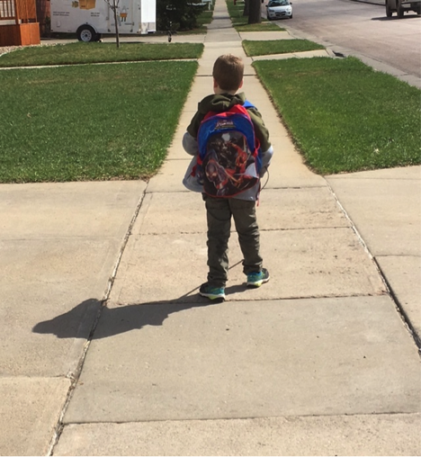 Liam uses his cane technique to get to the bus stop