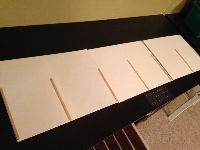 Canvas board taped together divided by wooden sticks