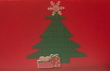 Holiday card with red background and green braille tree