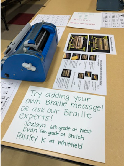 Braille station inviting people to braille their own message
