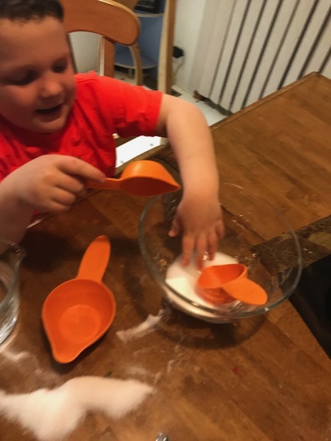 Liam checks the mixture. Checking the mixture