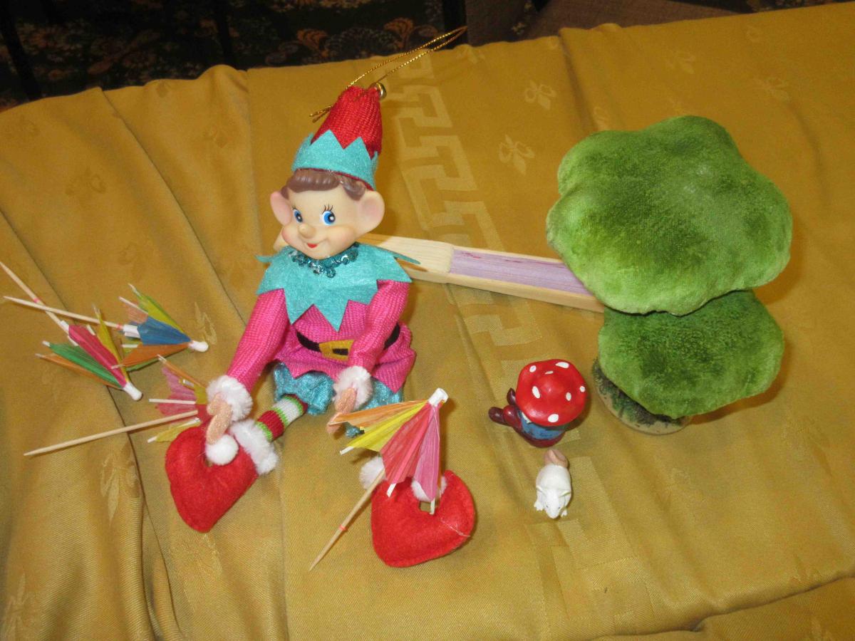 Elf with toadstool and mini umbrellas