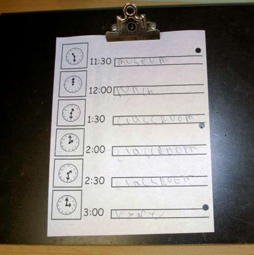 Clipboard with clock showing schedule