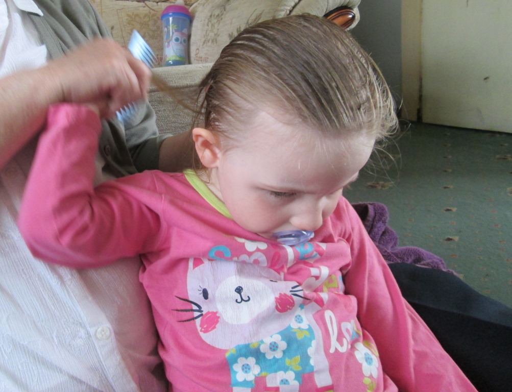 brushing Scarlett's hair