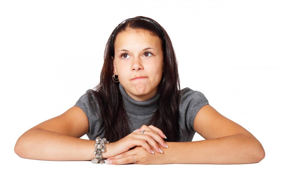 A girl appears to be deep in thought