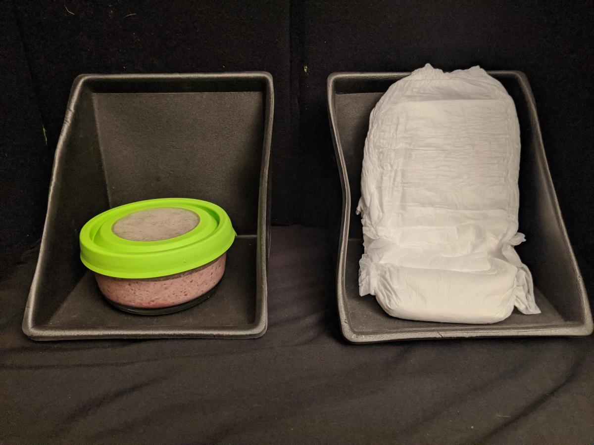 Real objects (lid of bowl and diaper) in expandable calendar box