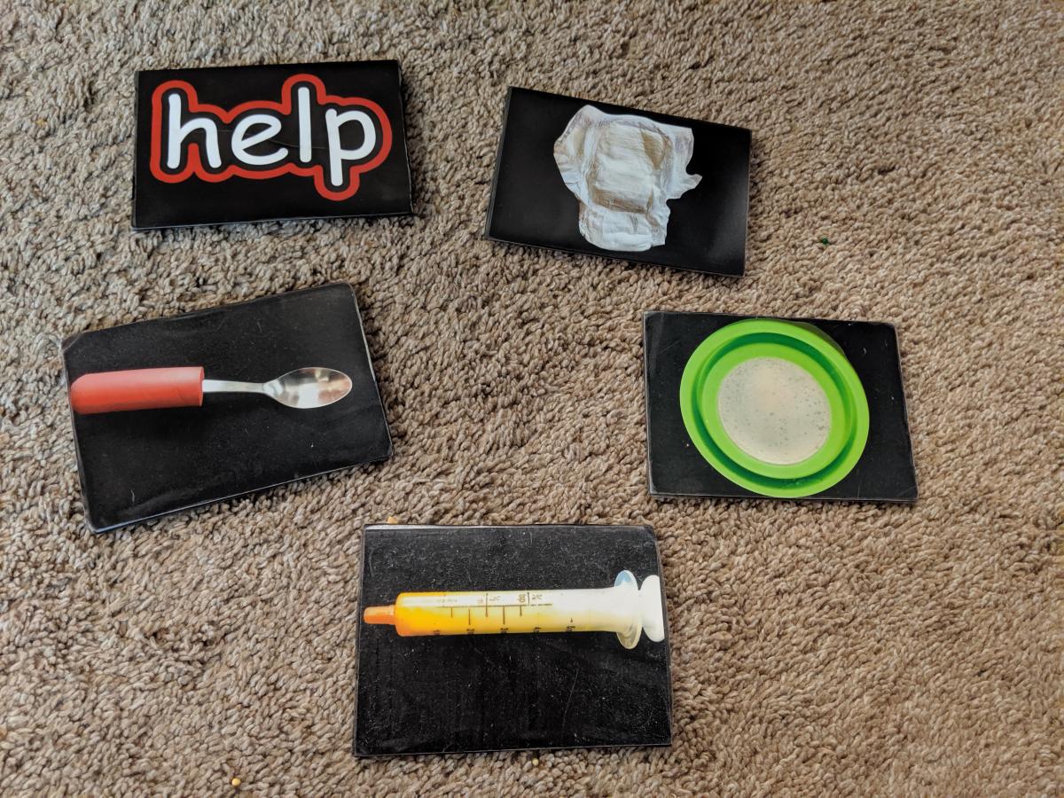 Photo cards for help, bathroom, spoon, food