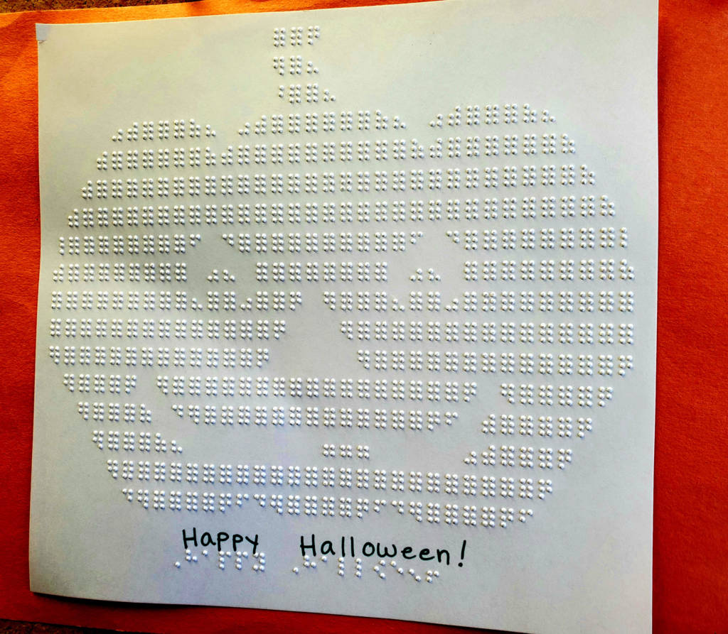 An embossed pumpkin on a piece of paper
