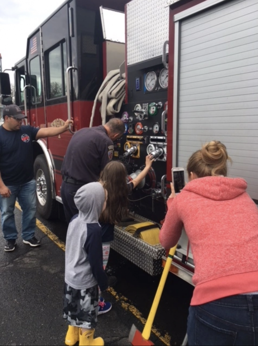 Children explore the fire engine.
