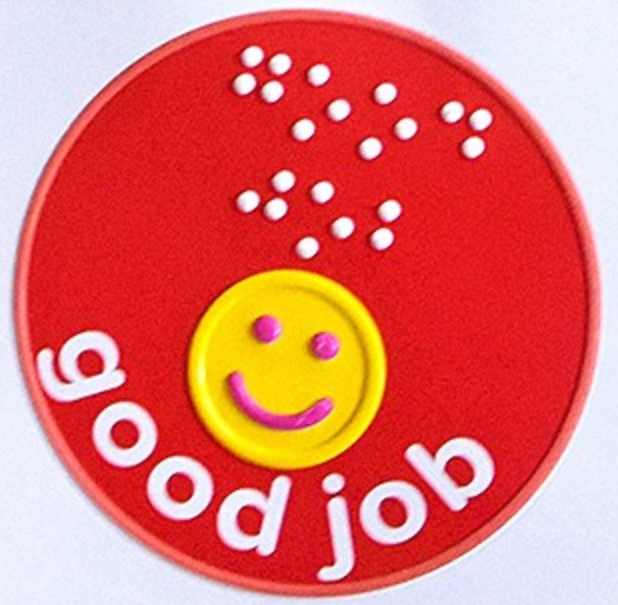 Tactile sticker saying 