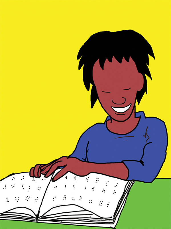 Smiling broadly, student uses both hands to look at a braille book.