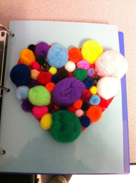 A pom-pom heart using pom-poms of various sizes