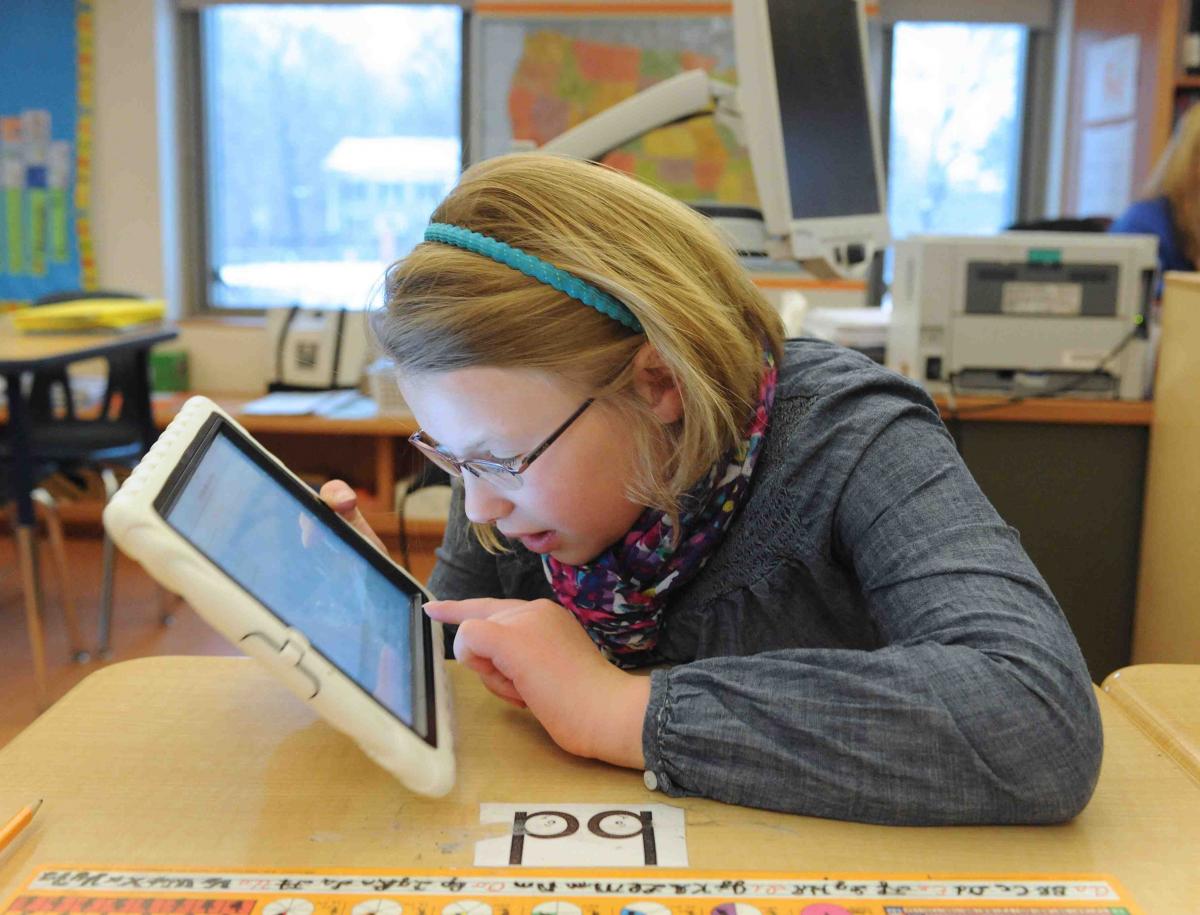 Girl using iPad in case