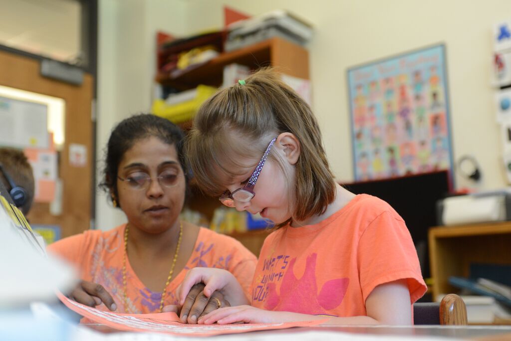 female student wearing orange tee shirt