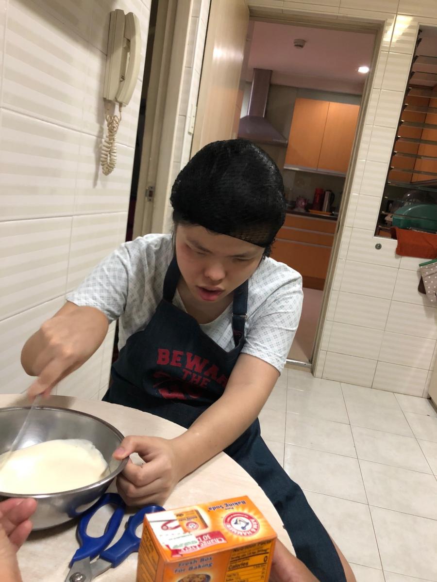 Kara stirring batter in a bowl