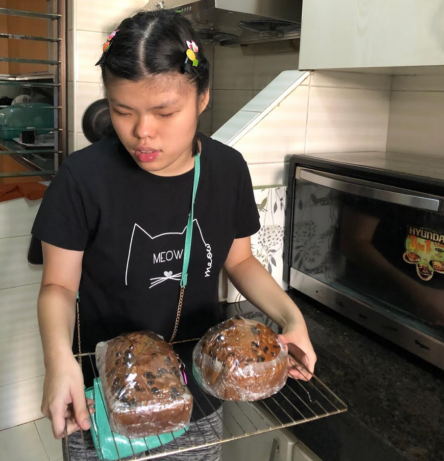 Kara holding a tray with her baked goods