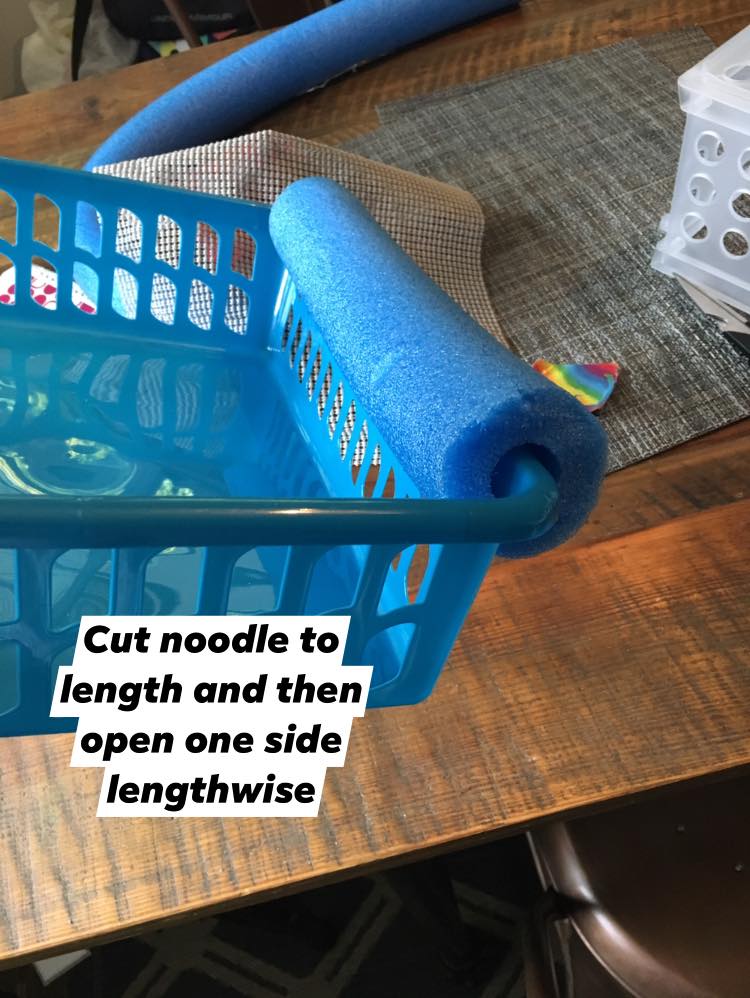 Swim noodle on edge of plastic basket