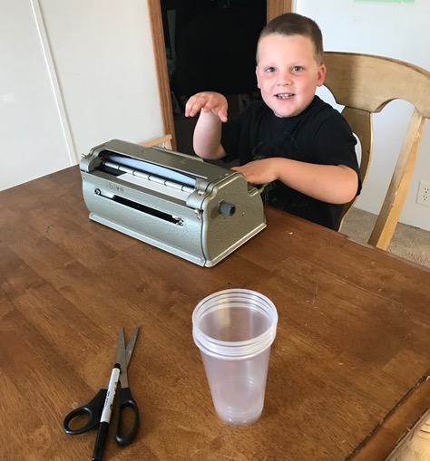 Liam enjoyed creating the braille labels for the cups!