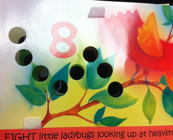 Ladybug book with 8 holes