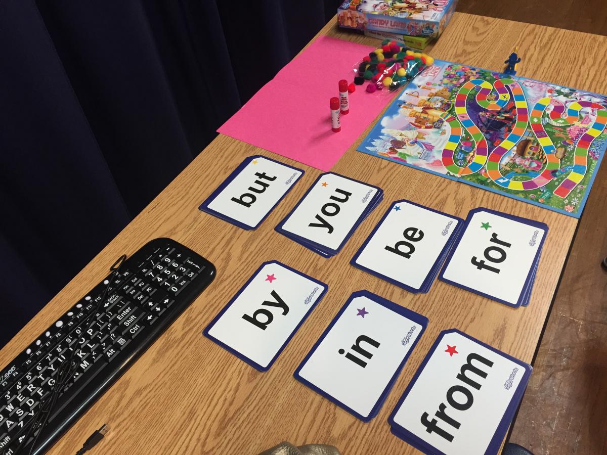 large print word cards and Candyland board