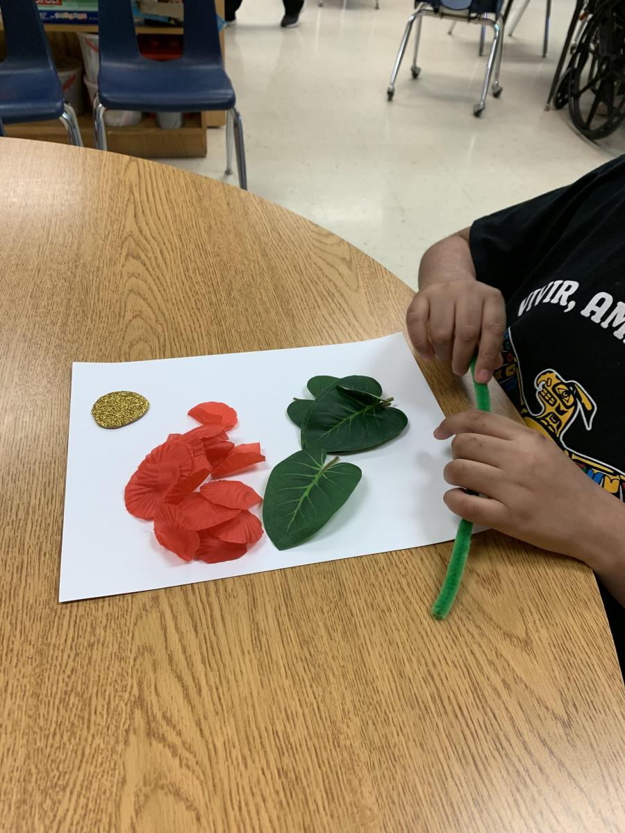 Arranging the parts of the flower on the paper