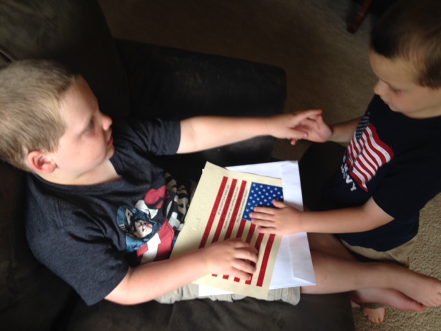 Looking at flag with younger brother Looking at flag with younger brother