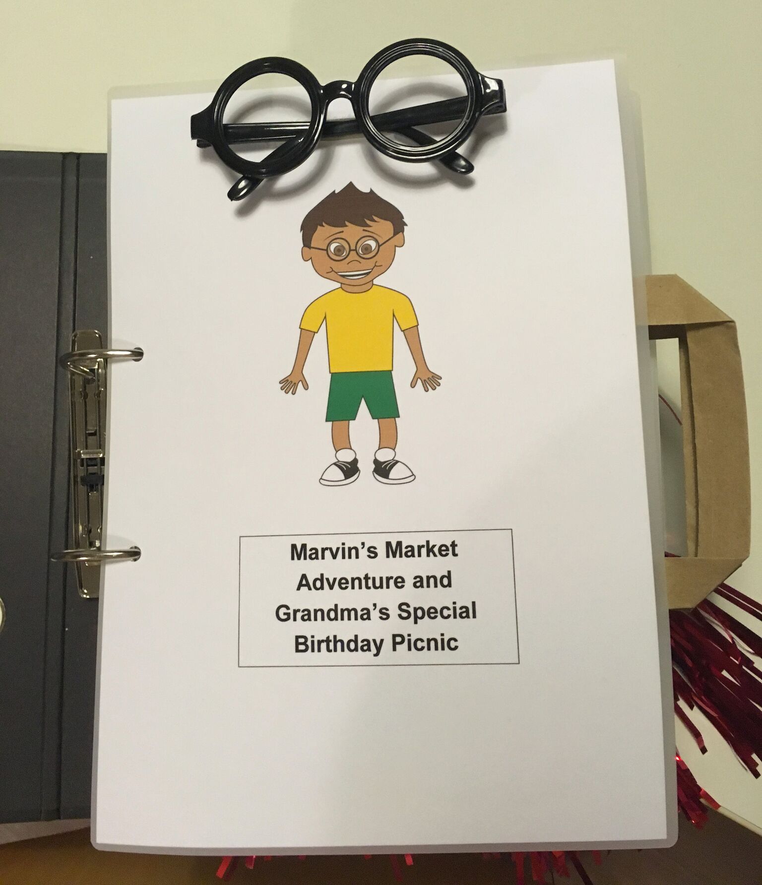 Title page of Marvin's Market Adventure with glasses attached