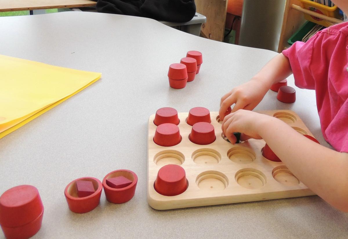 student playing memory caps game