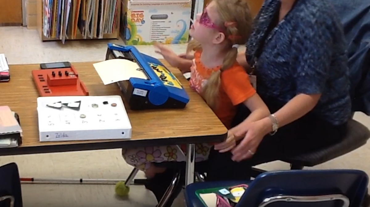 Using a Mountbatten Brailler with her teacher