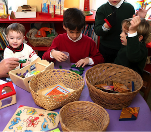 children around a table with crafts