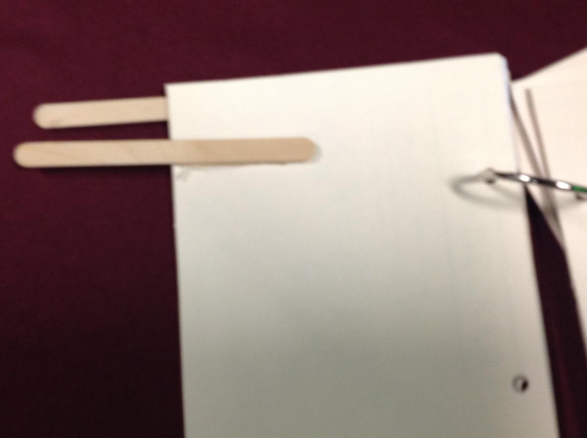 Page fluffer with popsicle sticks