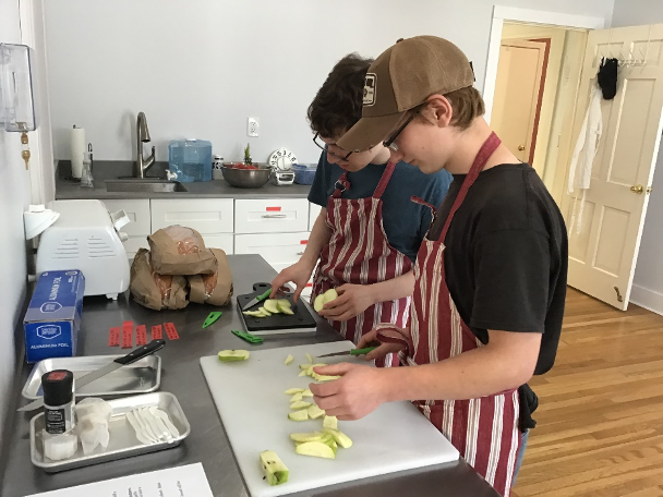 Students chopping vegetables